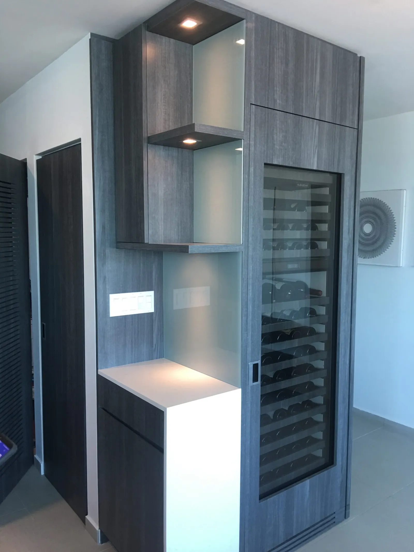 Custom wine cabinet with glass shelving
