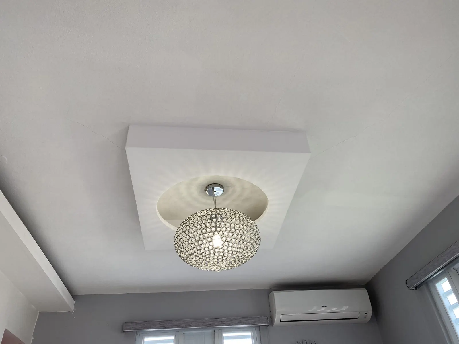 Fascia ceiling with a crystal light fixture