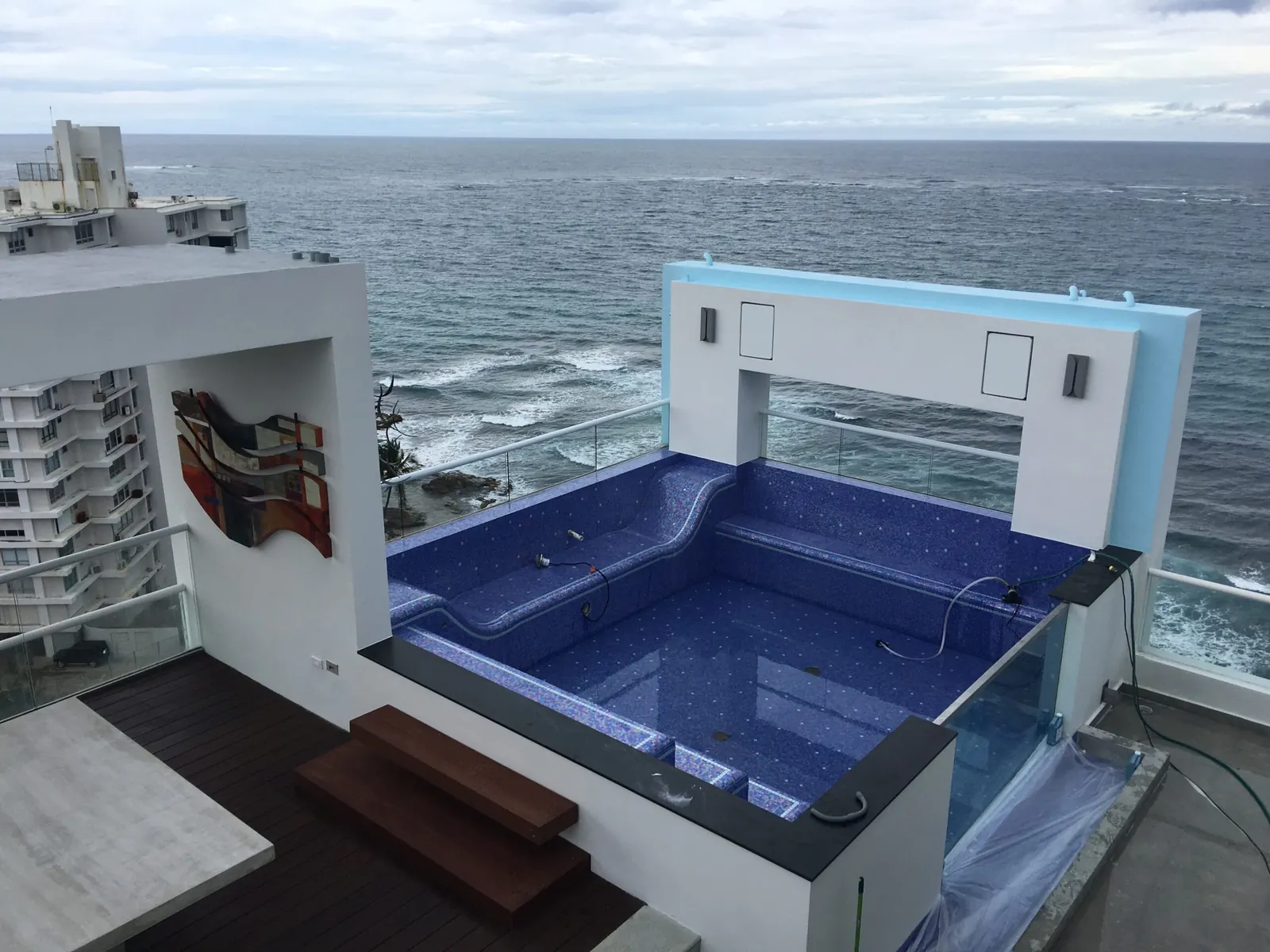 Rooftop pool and terrace remodel overlooking the ocean