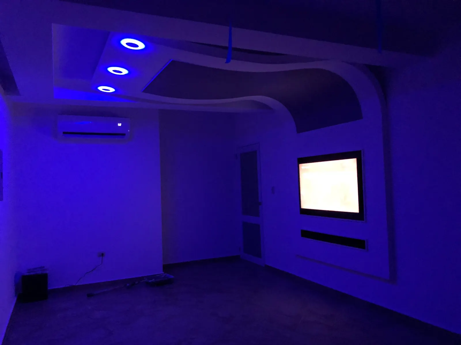 Home theater ceiling with blue LED cove lighting