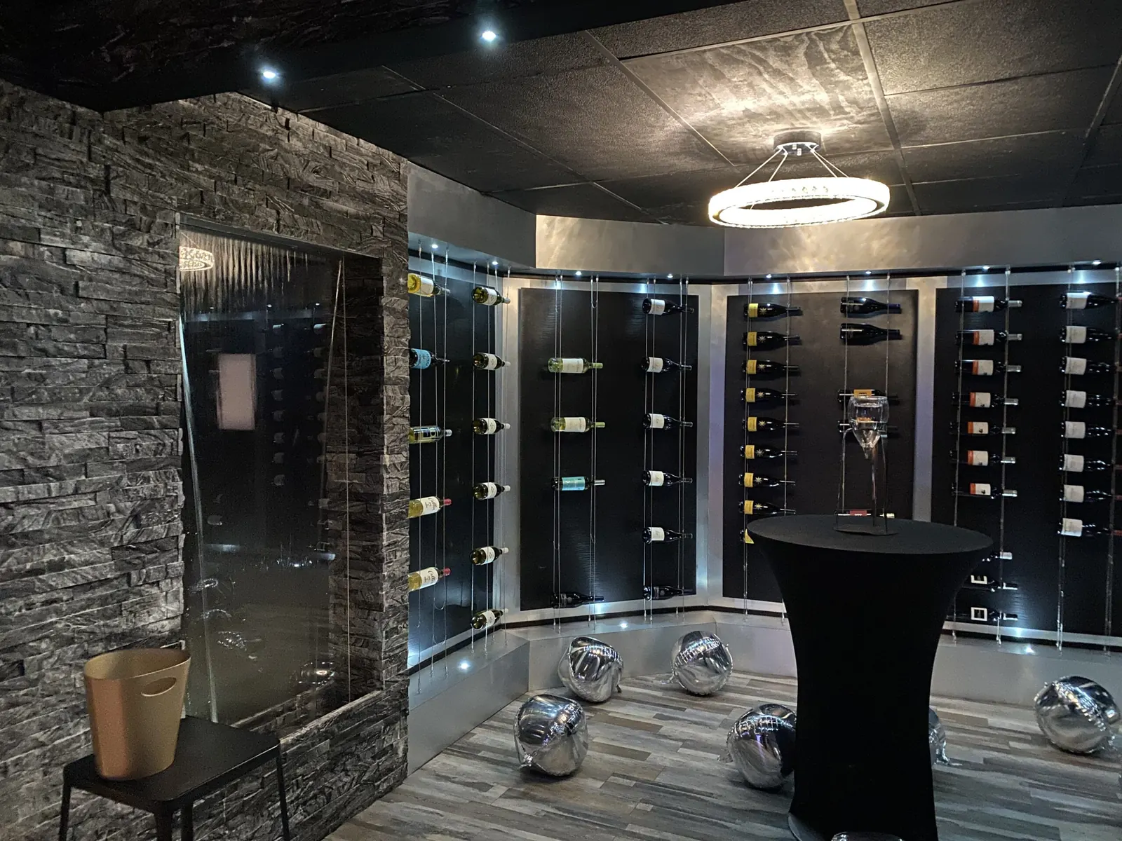 Wine room with stone wall and display racks
